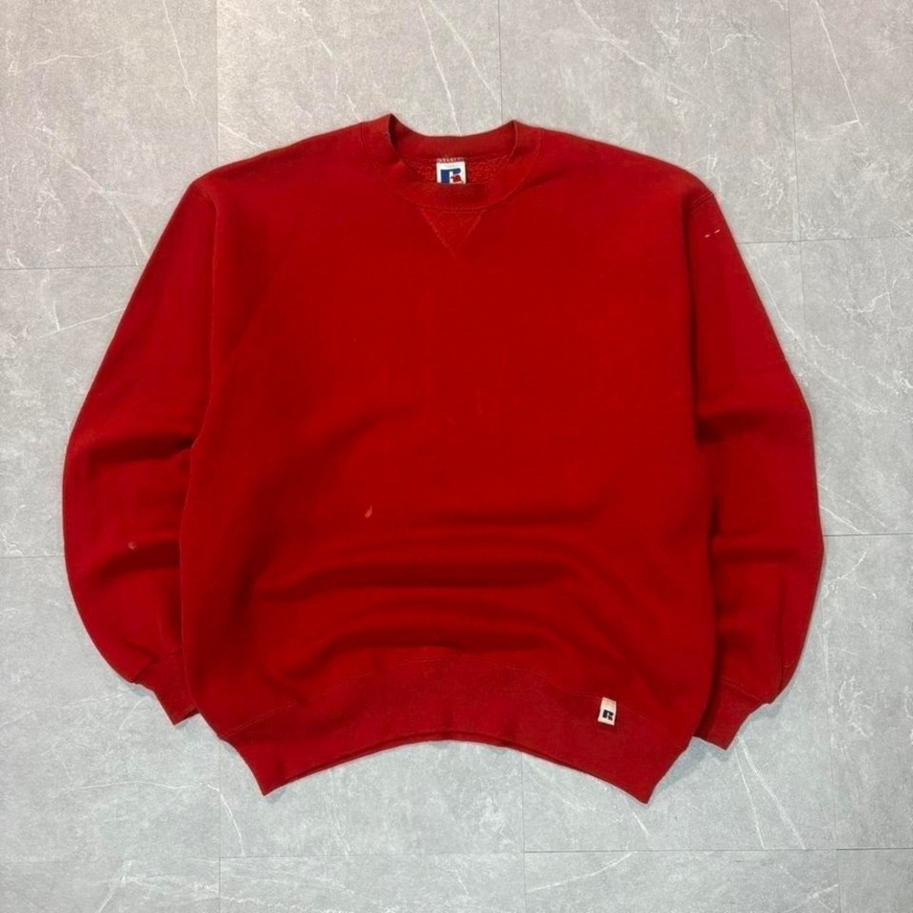Red vintage Russell Athletic‎ crewneck sweatshirt with a worn look